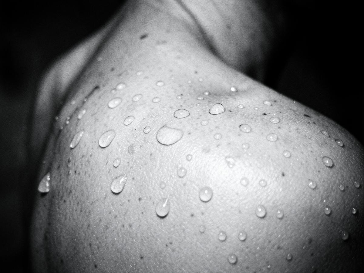 Black and white photograph of water on skin