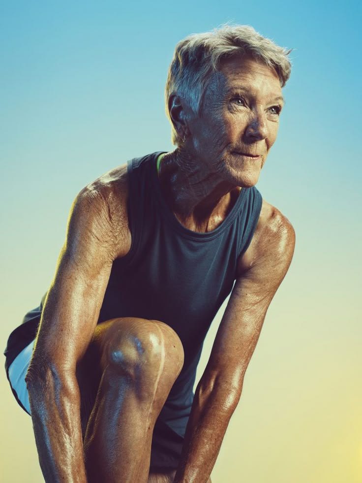 An older woman in athletic clothing outdoors
